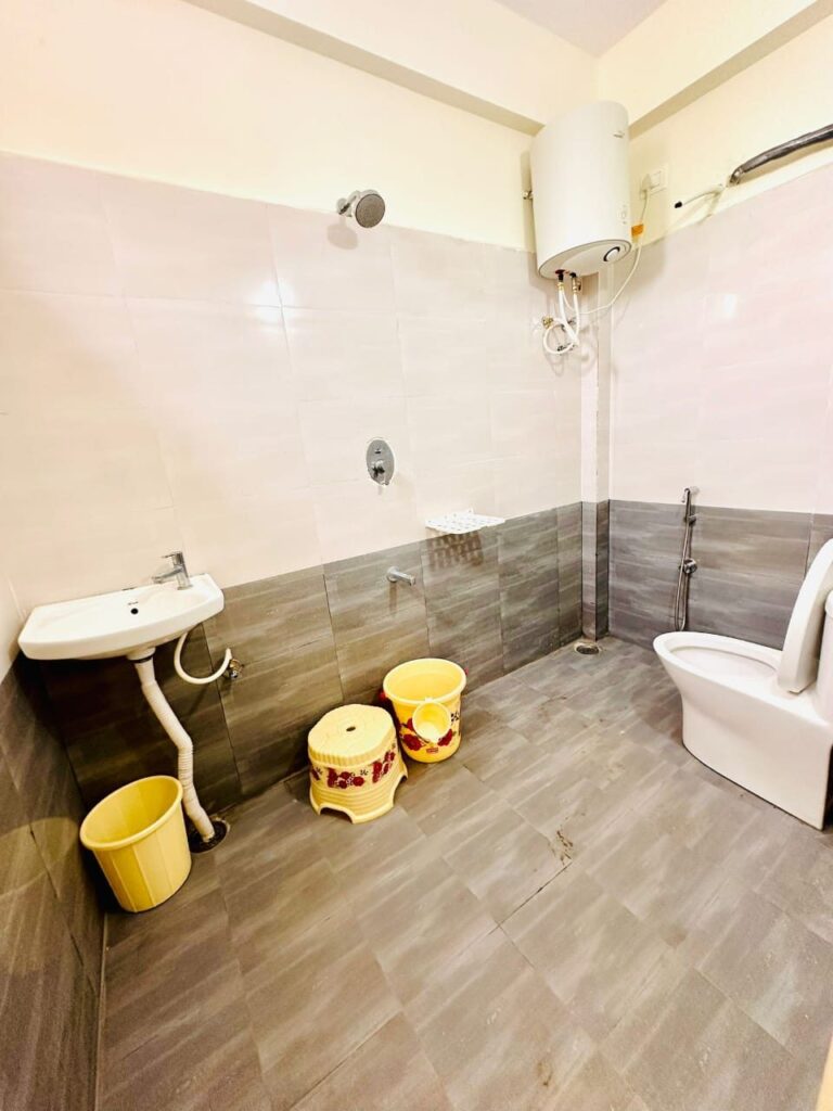 Attached bathroom with geyser at VK Residency